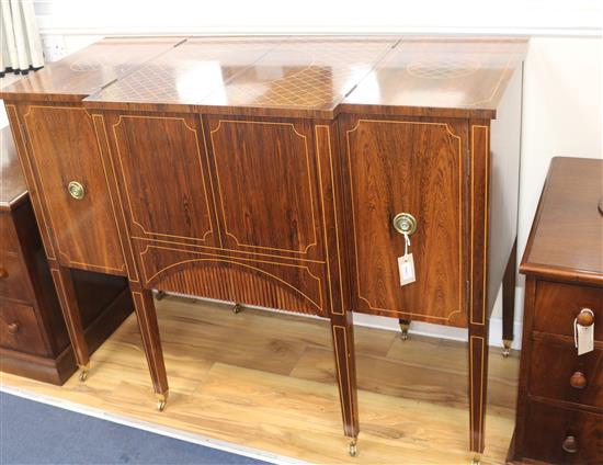 An inlaid rosewood metamorphic cocktail cabinet, in the form of a breakfront commode, W.123cm